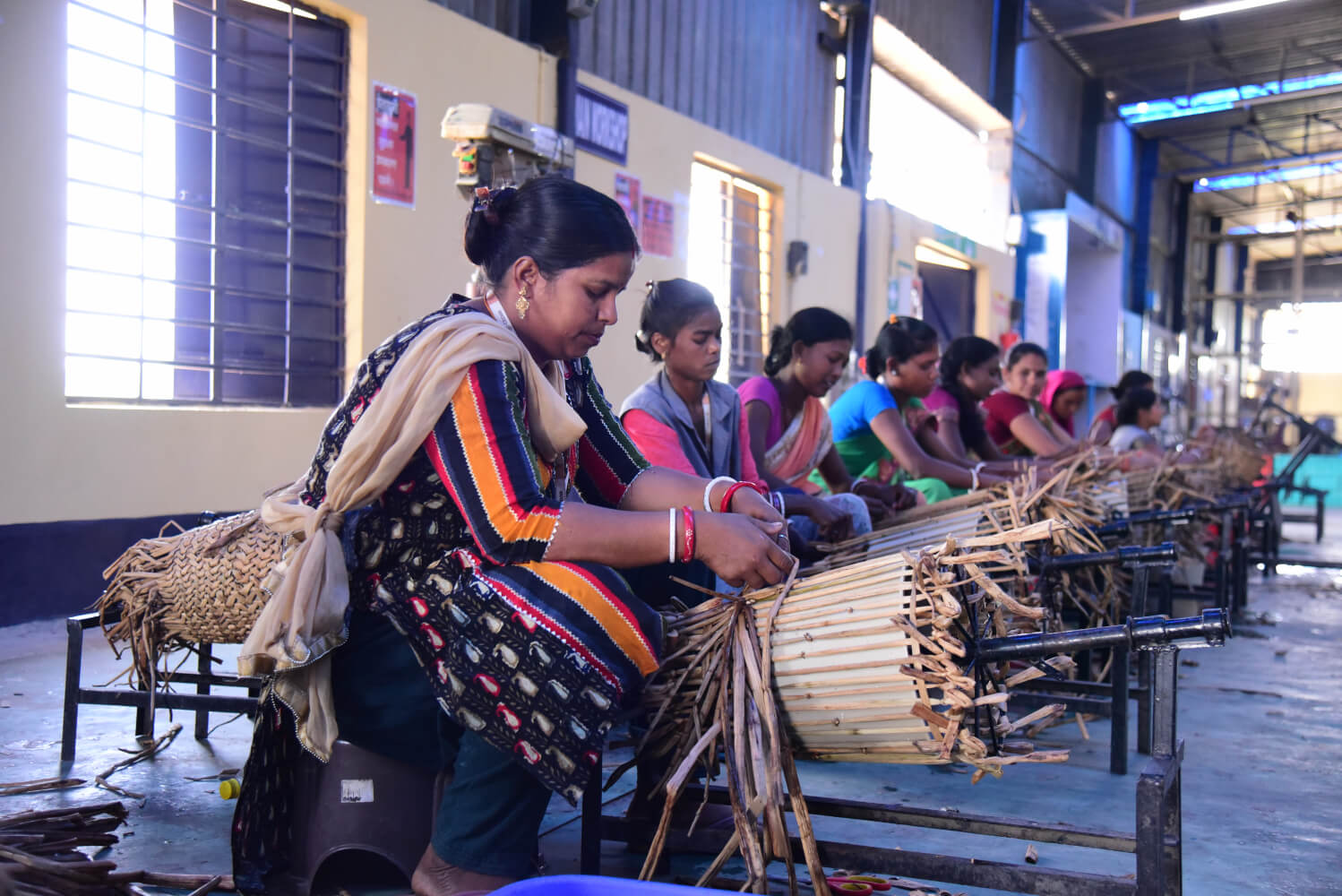 Bamboo craft artisans with finished bamboo products